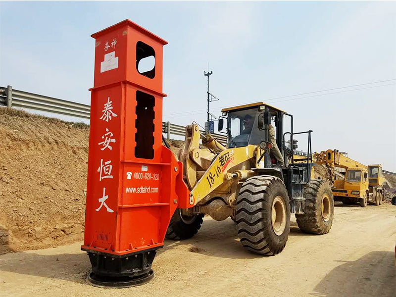 Therapid impact compaction equipment is installed on the loader for construction