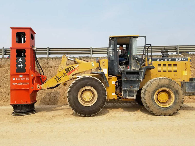 The Rapid Impact Compactor is installed on the loader for construction