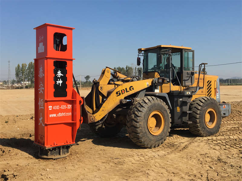 The Rapid Impact Compaction is installed on the loader for construction